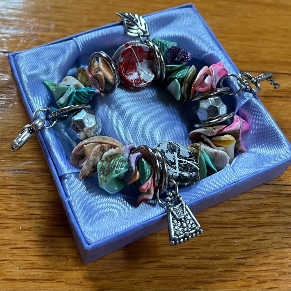 Colorful shell bracelet with silver charms